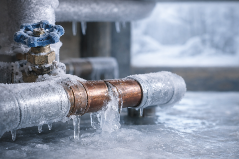 A frozen pipe in a basement. 