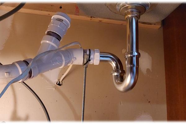 Kitchen sink drain with an added vent.