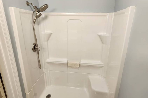 Brand new shower system with a dual showerhead installed by Applause Plumbing in Easton, PA. Revamp your bathroom with a luxurious walk-in shower installation and enjoy the ultimate relaxation experience at home.