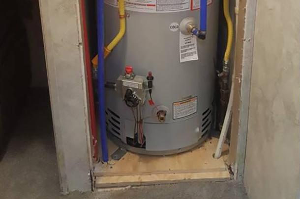 Compact water heater installation in a confined space by Applause Plumbing in Nazareth, PA. This specialized solution ensures safety and efficiency for small dwellings or trailers, optimizing space and providing reliable hot water supply.