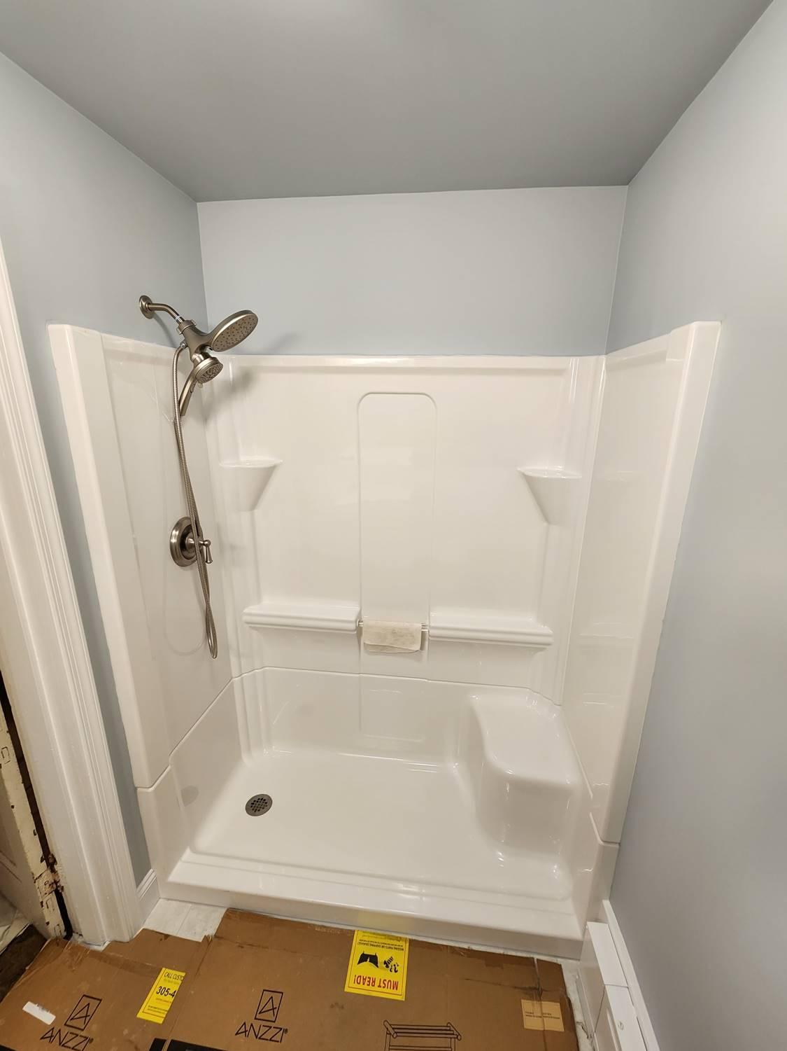 Brand new shower system with a dual showerhead installed by Applause Plumbing in Easton, PA. Revamp your bathroom with a luxurious walk-in shower installation and enjoy the ultimate relaxation experience at home.