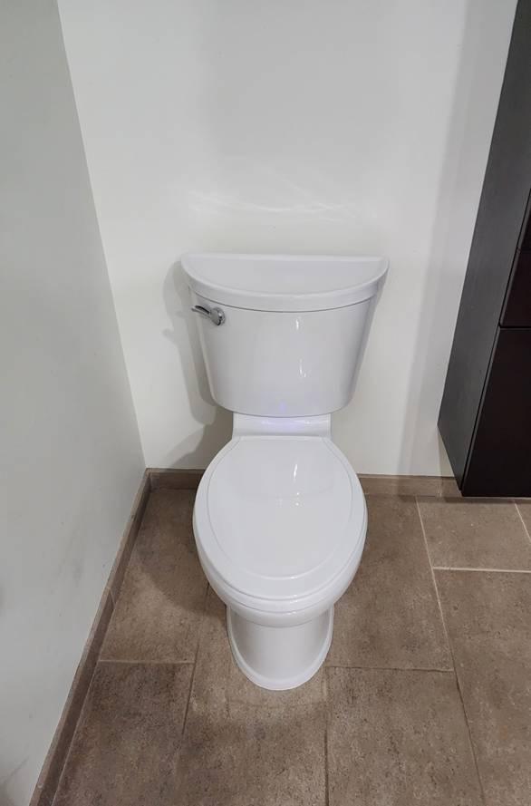 A brand-new white toilet installed by Applause Plumbing and Heating in Easton, PA! This modern toilet features a motion-sensor light-up bowl for added convenience and style. Upgrade your bathroom with expert plumbing services today!