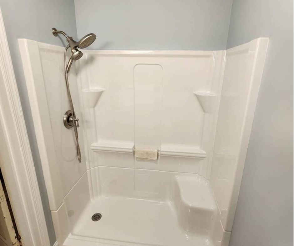 Brand new shower system with a dual showerhead installed by Applause Plumbing in Easton, PA. Revamp your bathroom with a luxurious walk-in shower installation and enjoy the ultimate relaxation experience at home.